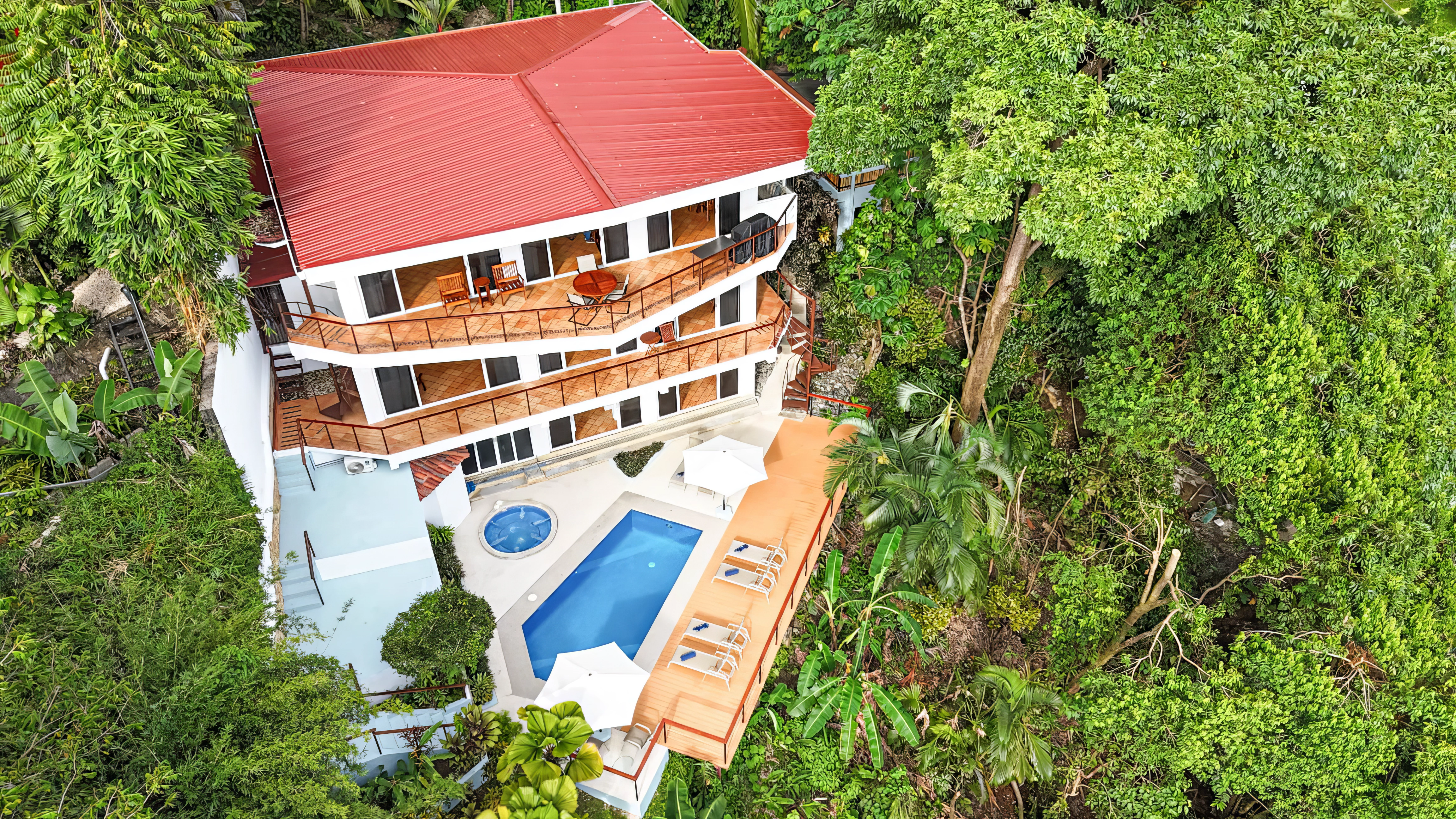 Perched in the vibrant heart of Manuel Antonio, Casa Alegría is a majestic three-story villa that masterfully blends high-end architectural luxury with the raw, untamed